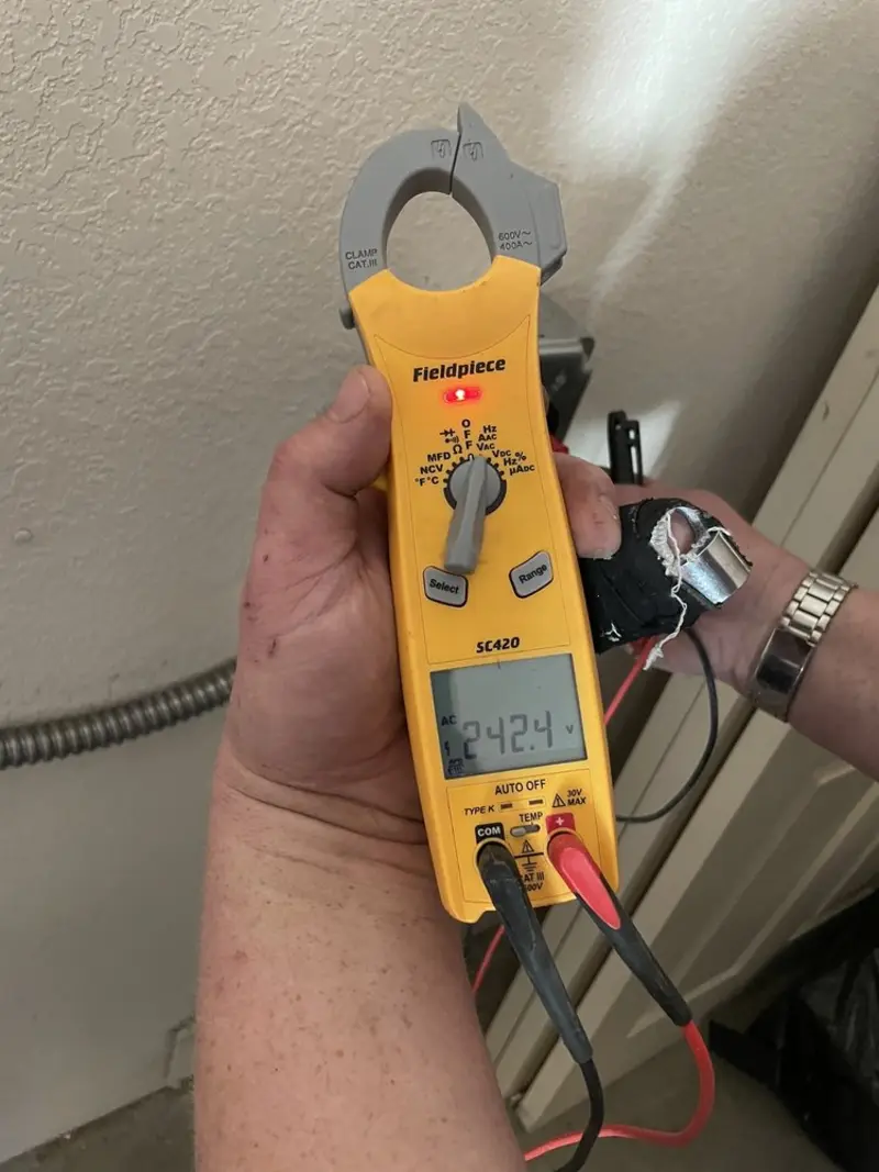 Voltage testing with clamp meter during Hot Tub / Pool Electrical Wiring in Belleville